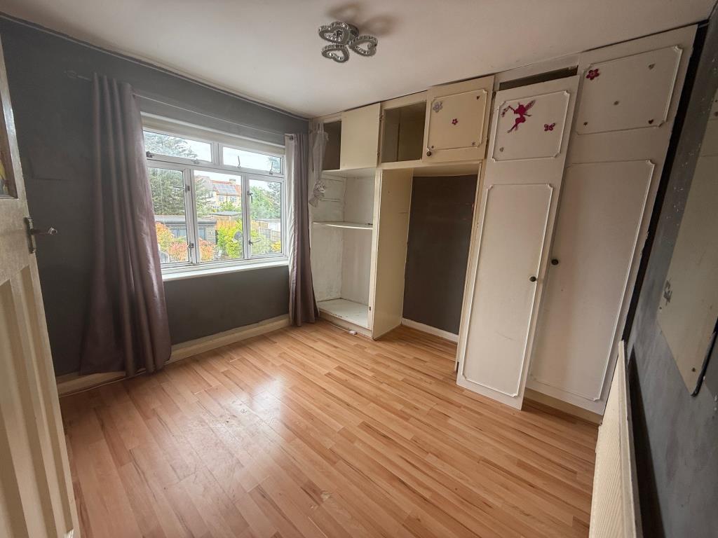 Lot: 166 - MID-TERRACE HOUSE FOR IMPROVEMENT - Bedroom with fitted wardrobes